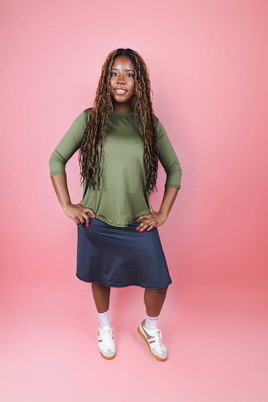 Transcendent Active Performance Quarter Sleeve Top in rich army green, featuring a modest, athletic fit with quarter-length sleeves, smooth performance fabric, and a flattering silhouette designed for movement and everyday wear.