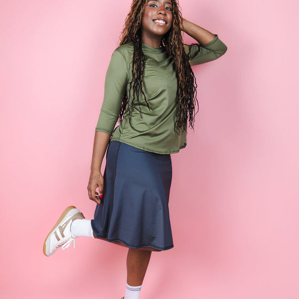 Transcendent Active Performance Quarter Sleeve Top in rich army green, featuring a modest, athletic fit with quarter-length sleeves, smooth performance fabric, and a flattering silhouette designed for movement and everyday wear.
