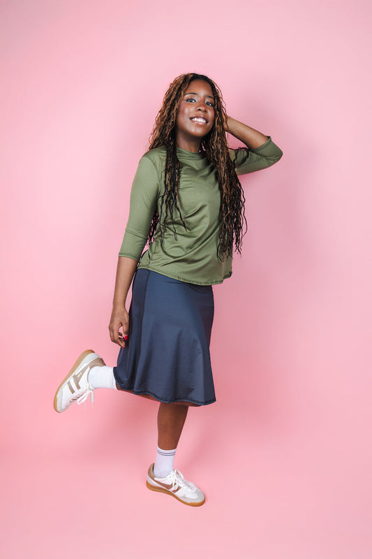 Transcendent Active Performance Quarter Sleeve Top in rich army green, featuring a modest, athletic fit with quarter-length sleeves, smooth performance fabric, and a flattering silhouette designed for movement and everyday wear.