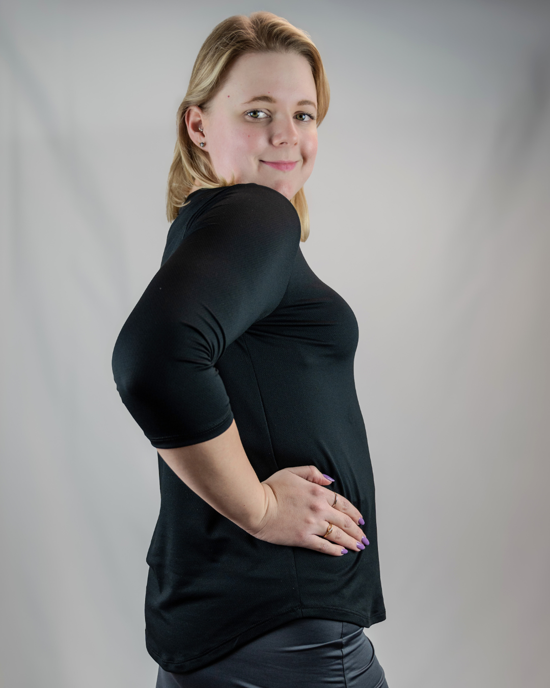 Transcendent Active black quarter sleeve performance top — a modest, sweat-wicking athletic shirt with antimicrobial fabric, designed for comfort, movement, and everyday wear.