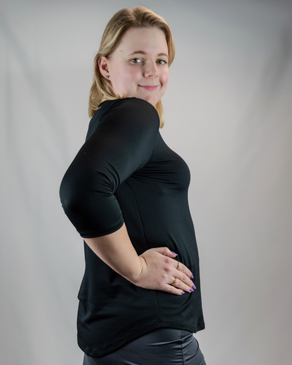 Transcendent Active black quarter sleeve performance top — a modest, sweat-wicking athletic shirt with antimicrobial fabric, designed for comfort, movement, and everyday wear.