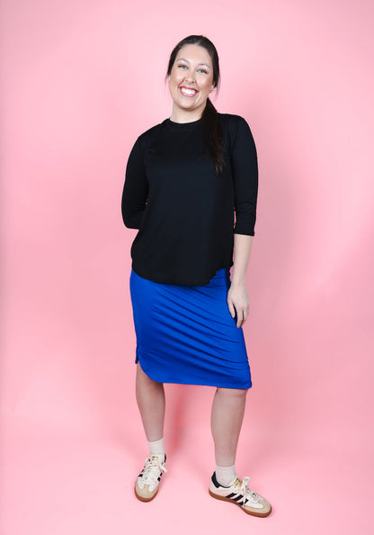 Transcendent Active Performance Quarter Sleeve Top in black, featuring a modest, athletic fit with quarter-length sleeves, smooth performance fabric, and a flattering silhouette designed for movement and everyday wear.