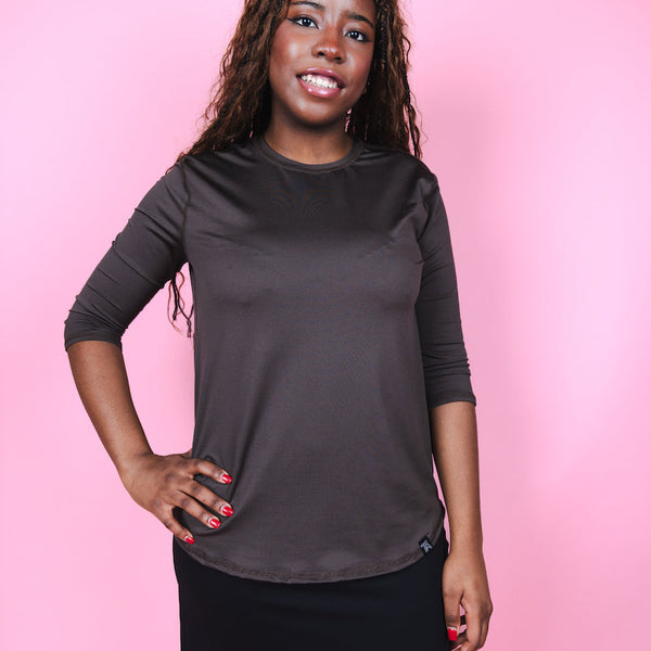 Transcendent Active Performance Quarter Sleeve Top in rich chocolate brown, featuring a modest, athletic fit with quarter-length sleeves, smooth performance fabric, and a flattering silhouette designed for movement and everyday wear.